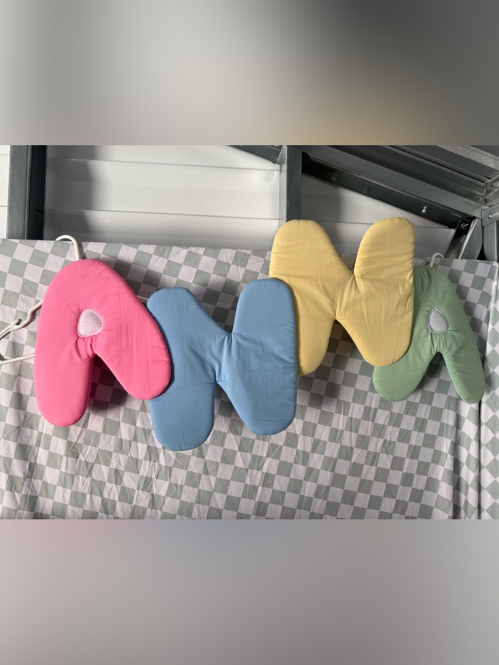 Vintage fabric alphabet letters spelling out “ANNA” nursery decor
